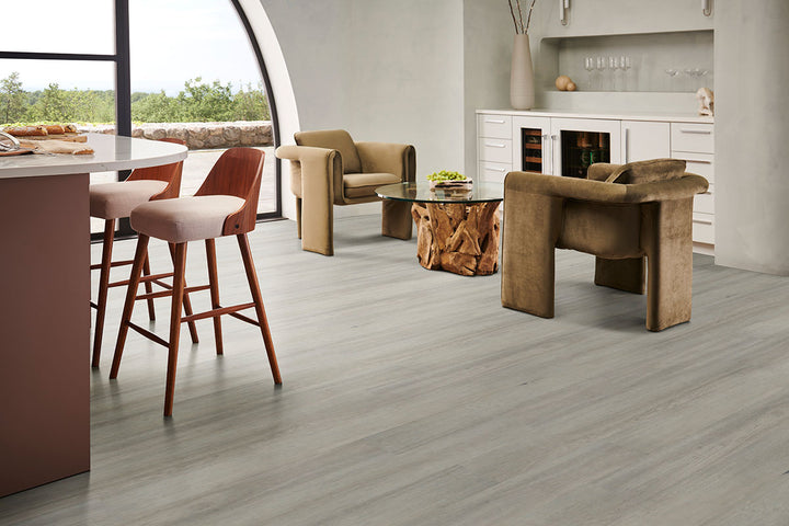 Chic interior with Prescott Brianka 7x48 low gloss luxury vinyl flooring, blending cool brown tones and authentic woodgrain for a contemporary and versatile setting.