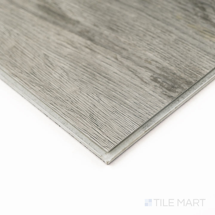 Close-up of the corner of Prescott Kardigan 7X48 Low Gloss Luxury Vinyl Plank, showcasing grain depth and tight seam alignment.