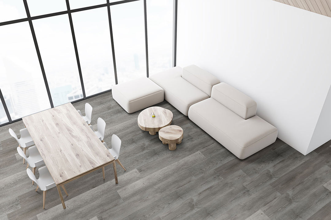 Open-plan layout highlighted by Prescott Katella Ash 7X48 flooring, offering a warm, contemporary vibe.