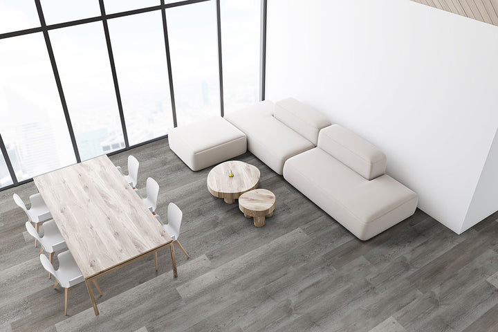 Open-plan layout highlighted by Prescott Katella Ash 7X48 flooring, offering a warm, contemporary vibe.