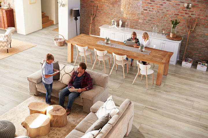 Wide-layout room using Prescott XL Akadia 9X60 flooring to emphasize clean lines and open flow.