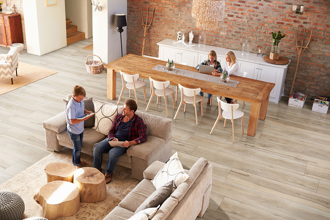Wide-layout room using Prescott XL Akadia 9X60 flooring to emphasize clean lines and open flow.