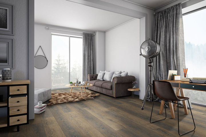 Spacious room featuring Prescott XL Barrel 9x60 low gloss luxury vinyl plank flooring, with wide-format planks in rich brown tones that create a grounded, rustic atmosphere.