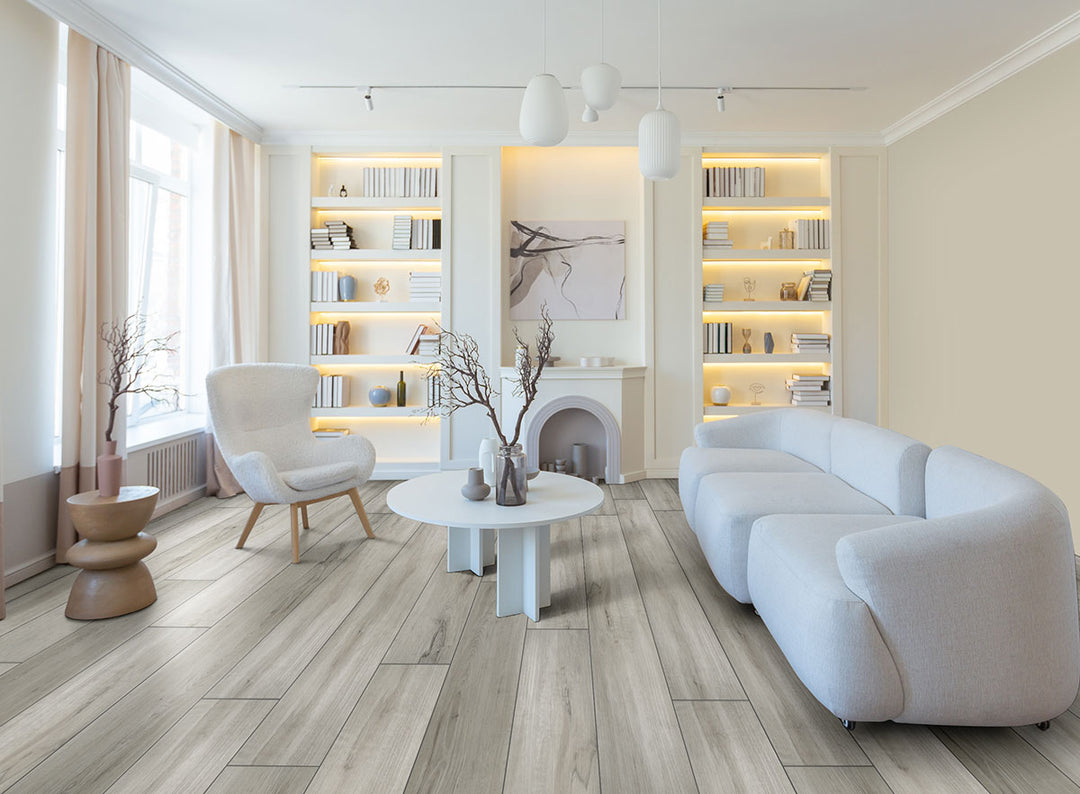 Prescott XL Dunite Oak 9x60 wide vinyl planks in a soft taupe palette, blending spacious format with authentic oak texture for a refined surface.