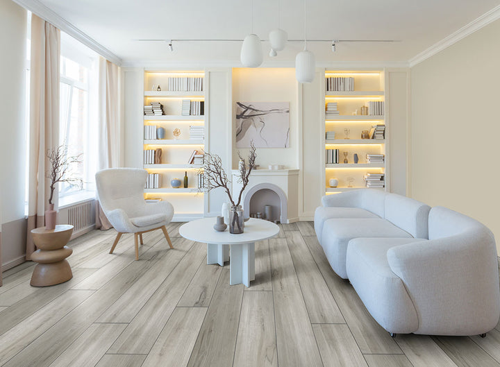 Prescott XL Dunite Oak 9x60 wide vinyl planks in a soft taupe palette, blending spacious format with authentic oak texture for a refined surface.