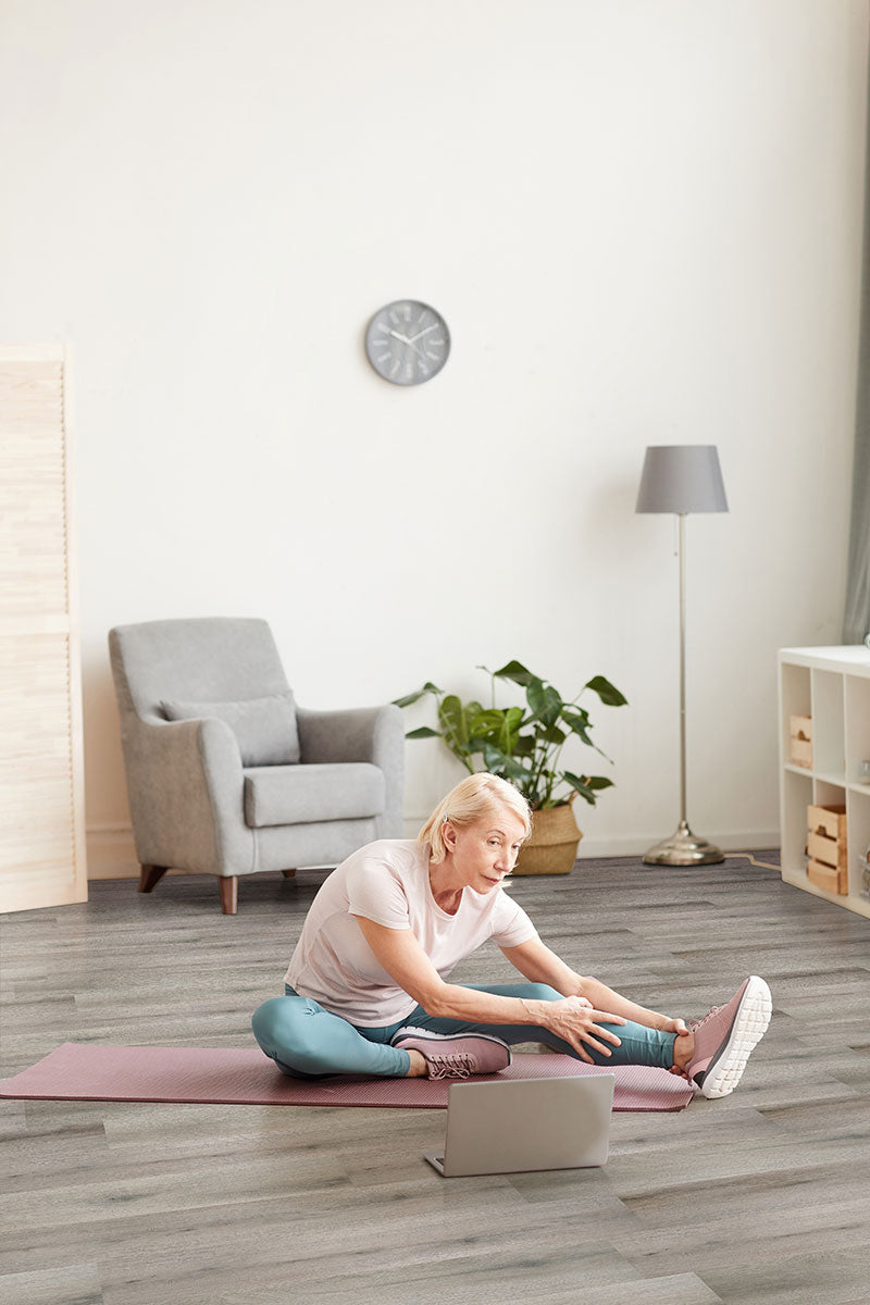 Modern living space featuring Smithcliffs Avery Ash 7x48 low gloss vinyl plank flooring, with soft ash-gray tones and natural wood texture for a sleek, versatile interior.