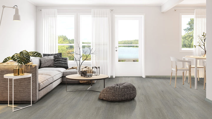 Stylized living area featuring Smithcliffs Emridge 7X48 flooring that complements cozy elements.