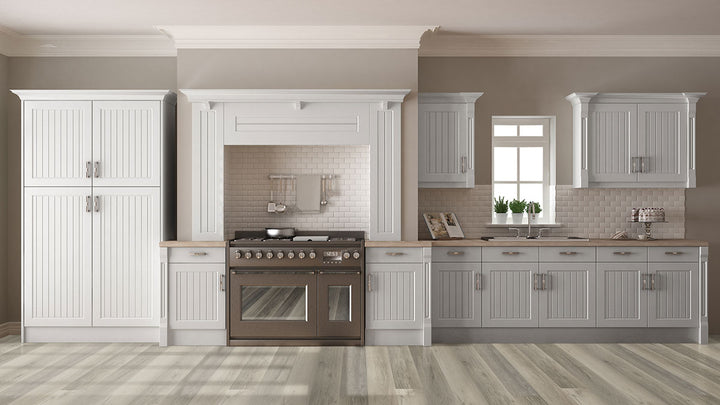 Warm-toned kitchen with Smithcliffs Malton 7x48 vinyl flooring, featuring golden-brown hues and subtle knots that evoke cozy traditional character.