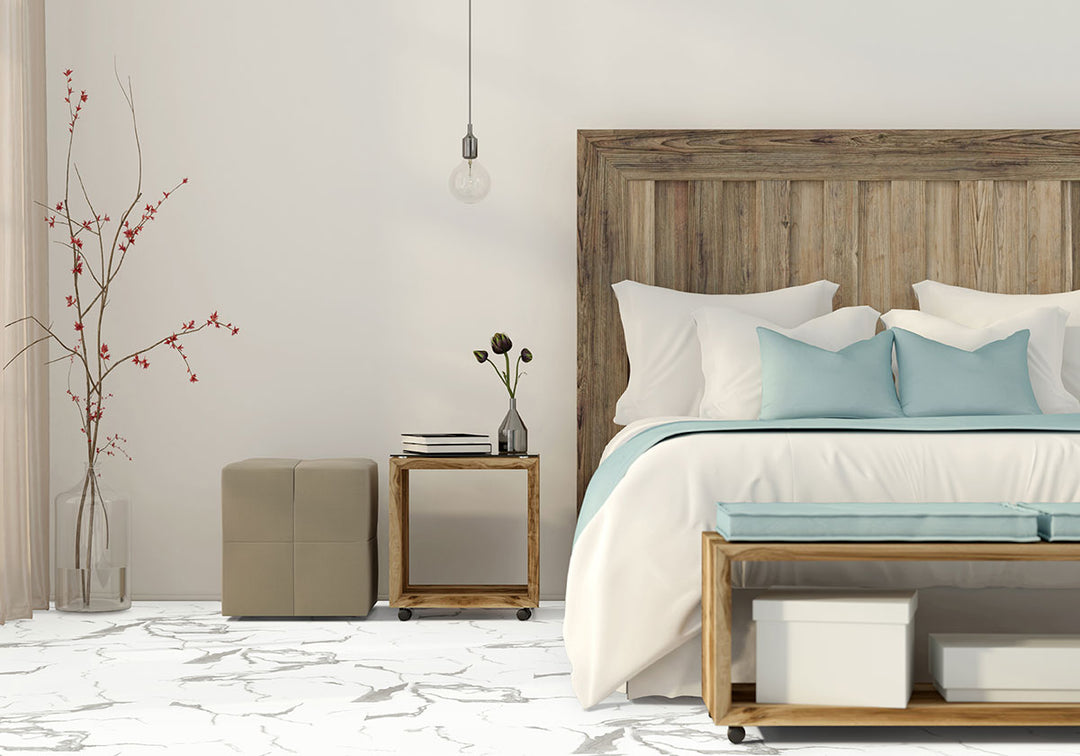 Sophisticated interior featuring Trecento Calacatta Marbello 12X24 flooring with natural stone flair.