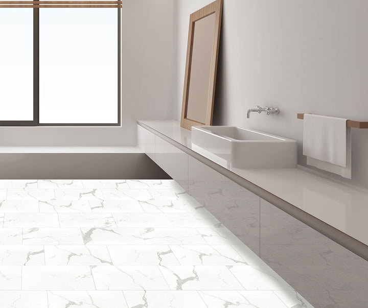 Elegant interior with Trecento Calacatta Marbello 12x24 low gloss vinyl flooring, featuring marble-look white tiles with dramatic gray veining for a classic, upscale look.