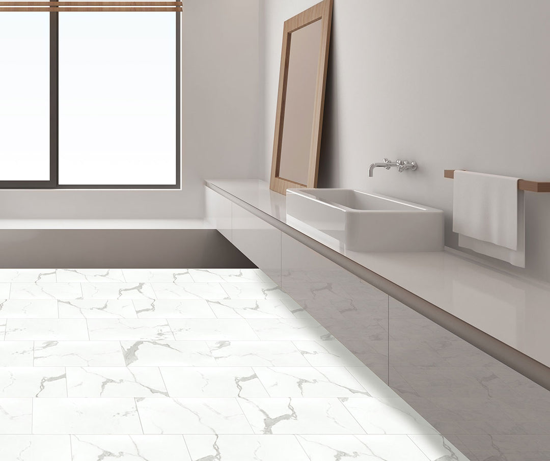 Elegant interior with Trecento Calacatta Marbello 12x24 low gloss vinyl flooring, featuring marble-look white tiles with dramatic gray veining for a classic, upscale look.