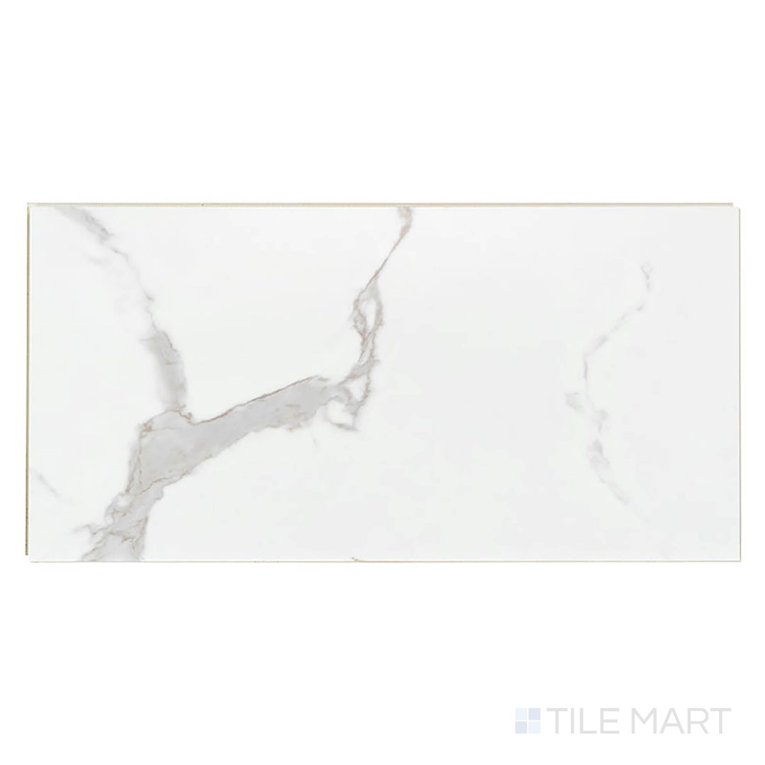 Seen from above, Trecento Calacatta Marbello 12x24 low gloss vinyl plank features soft white tones and gentle gray marble patterns.