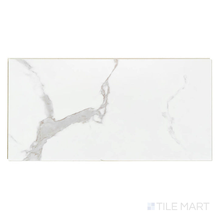 Seen from above, Trecento Calacatta Marbello 12x24 low gloss vinyl plank features soft white tones and gentle gray marble patterns.