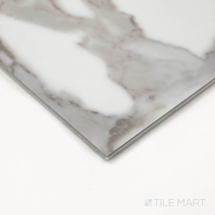 Trecento Calacatta Marbello 12X24 Low Gloss Luxury Vinyl Plank displayed at an angle to emphasize marble-like veining and edge profile.