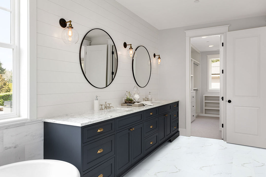 Bright and airy setting complemented by Trecento Calacatta Serra 12X24 marble-look flooring.