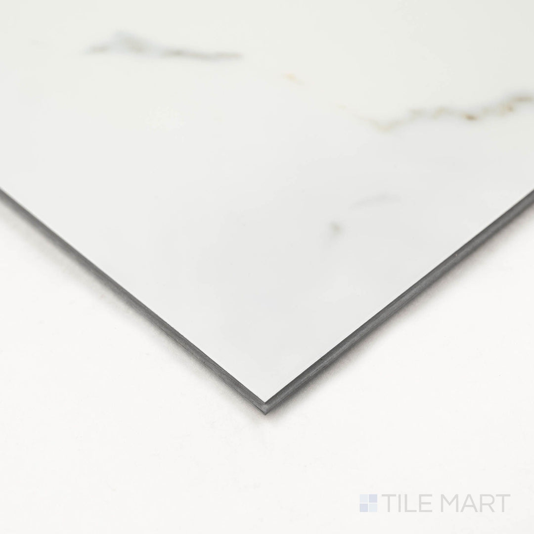 Angled close-up of Trecento Calacatta Serra 12X24 Low Gloss Luxury Vinyl Plank showing refined veining and smooth edge finish.