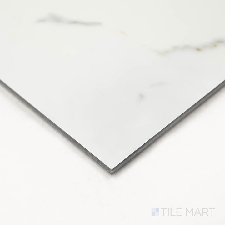 Angled close-up of Trecento Calacatta Serra 12X24 Low Gloss Luxury Vinyl Plank showing refined veining and smooth edge finish.