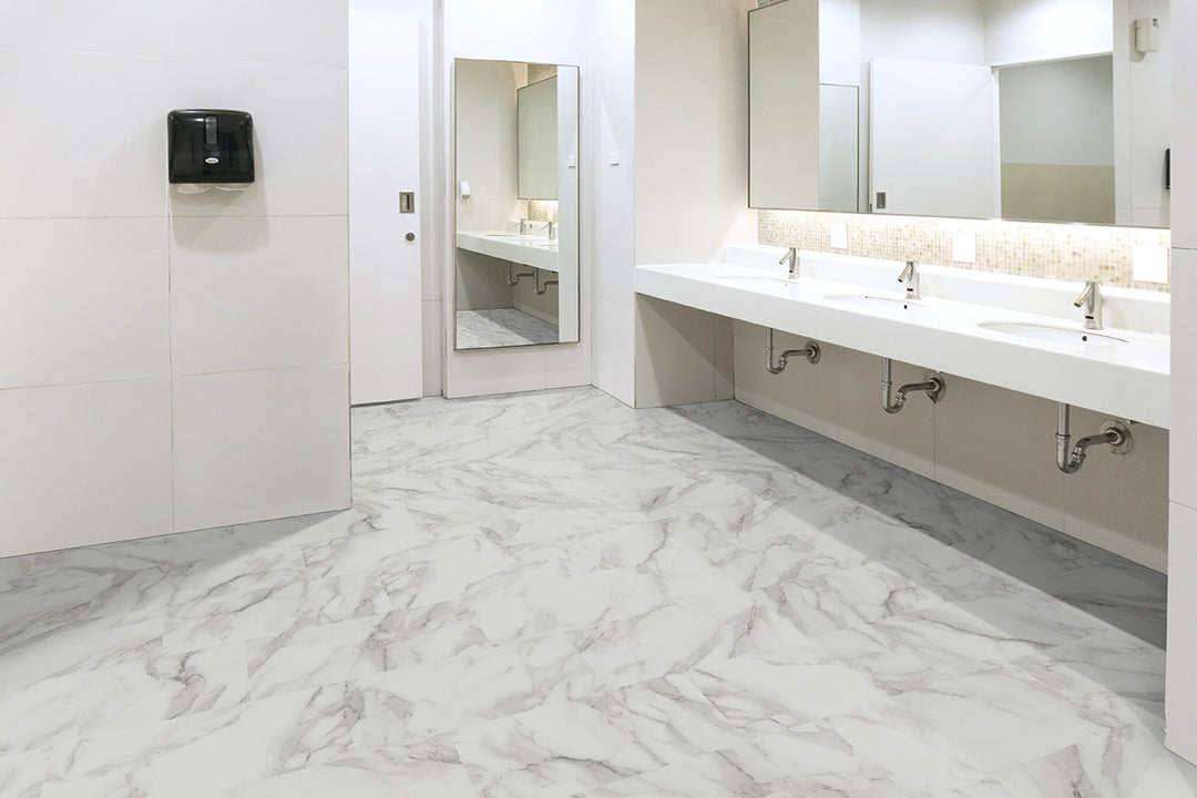 Sophisticated space showcasing Trecento Calacatta Venosa Gold 12x24 luxury vinyl plank flooring, with golden veining over a bright marble background for a refined, warm elegance.