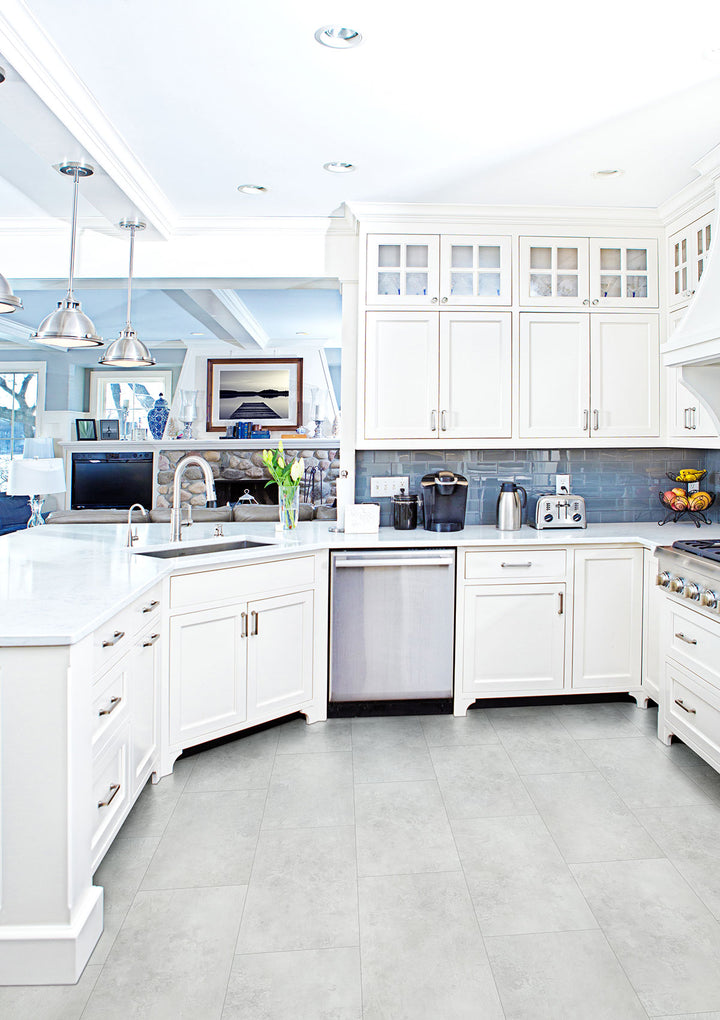 Modern room featuring Trecento Mountains Gray 12x24 vinyl flooring, offering a cool-toned stone-look finish ideal for sleek, contemporary interiors.