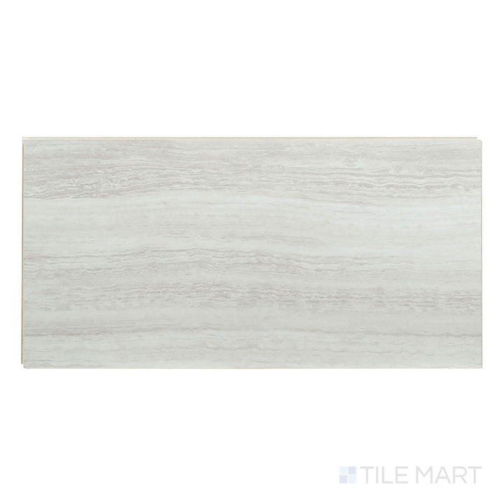 Presented from above, Trecento White Ocean 12x24 low gloss vinyl plank features bright white stone appearance with subtle veining.