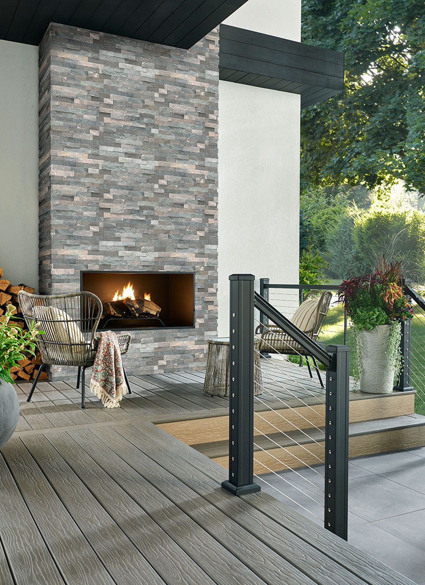 Rich blue and earthy stone textures create a striking contrast, harmonizing beautifully with Rockmount Sierra Blue 6X24 Stacked Stone Panel Splitface Quartzite.