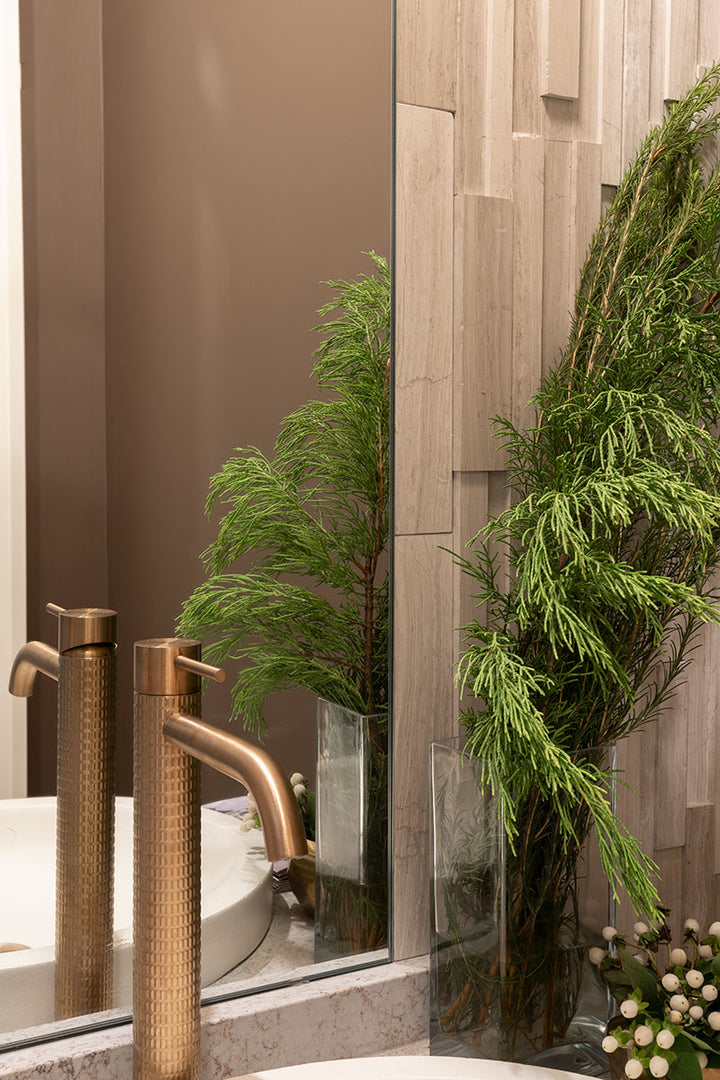Sleek honed marble and a 3D stacked design give Rockmount White Oak 6x24 stone panels a refined and dimensional appeal.
