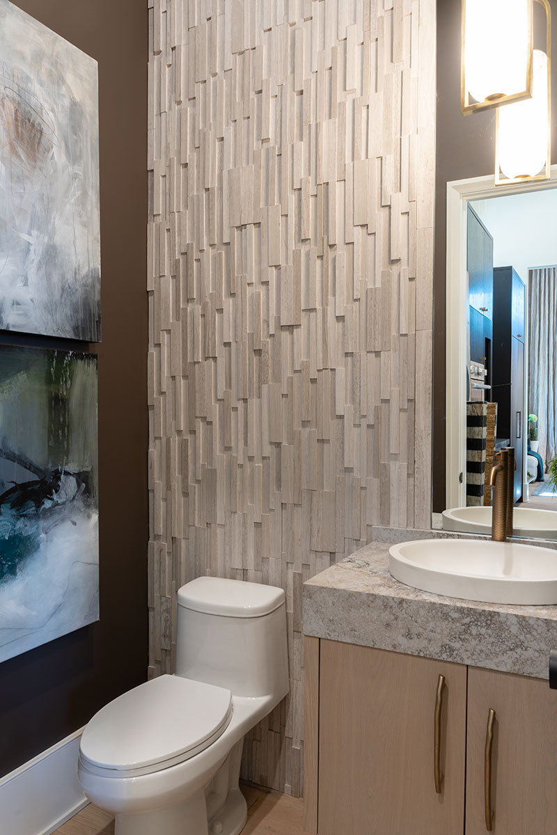 A striking 3D texture enhances the natural beauty of honed marble, offering a sophisticated look with Rockmount White Oak 6x24 3D stacked stone panel honed marble.