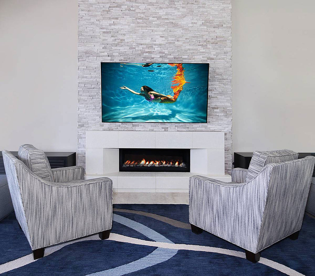 A splitface marble texture and soft white-gray tones create a sophisticated and natural look with Rockmount White Oak 6x24 stacked stone panels.