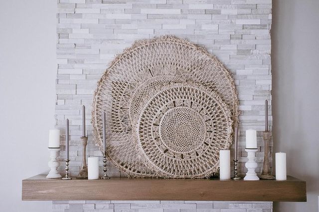 Warm, natural tones in a stacked stone arrangement create a rustic charm, complementing Rockmount White Oak 6X24 Stacked Stone Panel Splitface Marble.