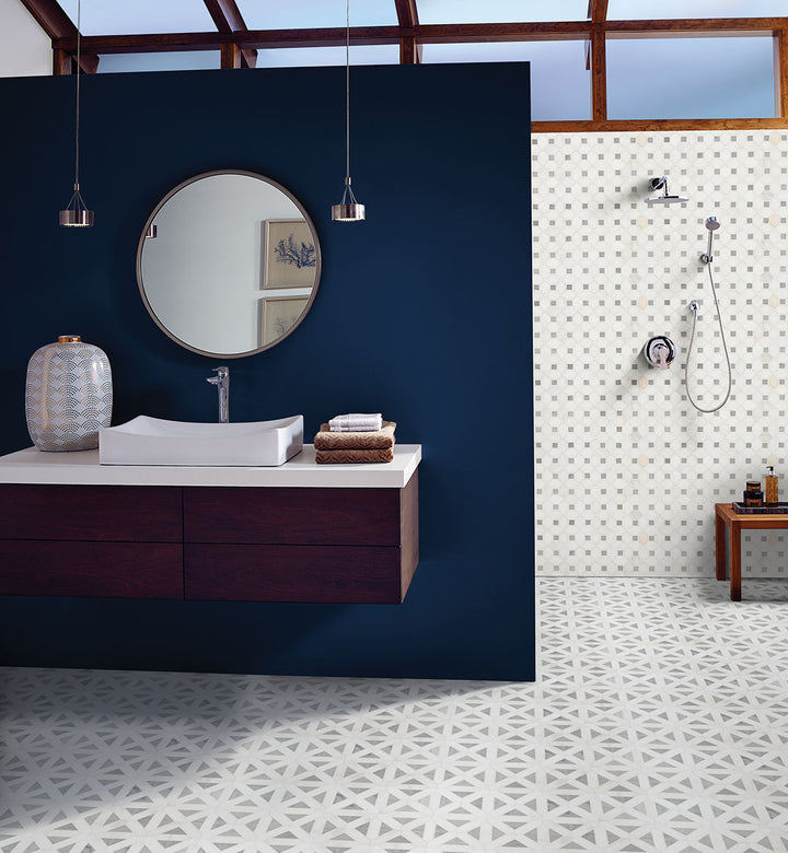 The polished finish and dot-like marble pattern of Bianco Dolomite Dotty mosaic create a refined yet dynamic aesthetic.