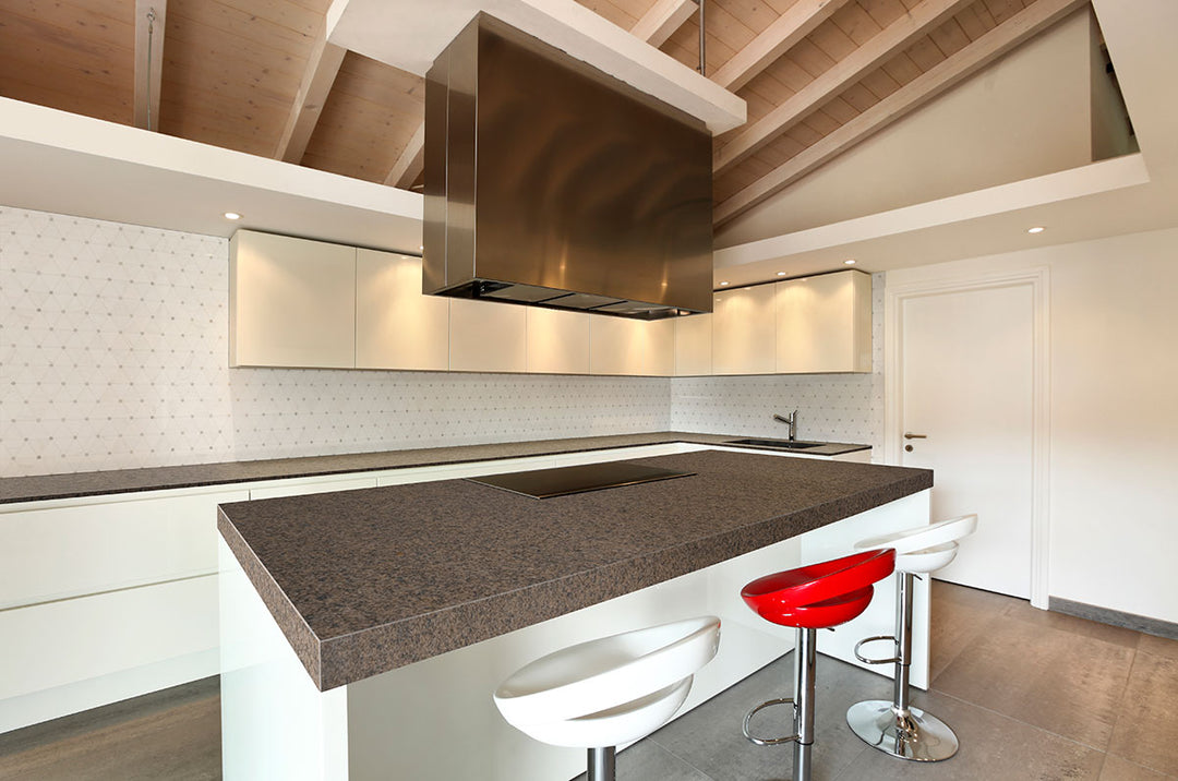 A pinwheel design crafted from polished marble introduces a sophisticated yet playful touch, beautifully achieved with Bianco Dolomite Pinwheel polished marble mosaic.