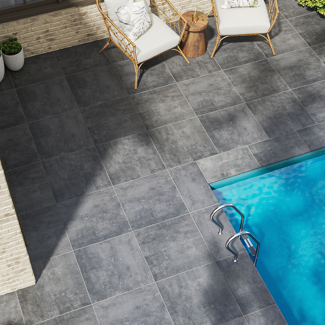 Deep anthracite tones and a matte finish give Benton Antracite 13x24 coping porcelain a bold and durable edge.