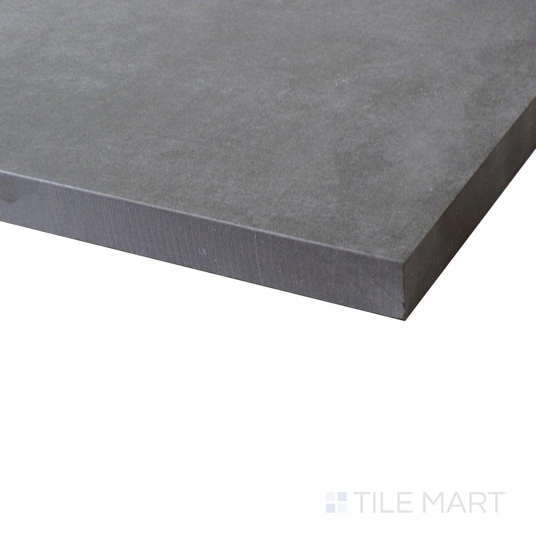 Corner shot of BETON ANTRACITE 24X24 PAVER PORCELAIN PAVER with a MATTE finish, offering a close-up look at the product's durability and material thickness at the corner.