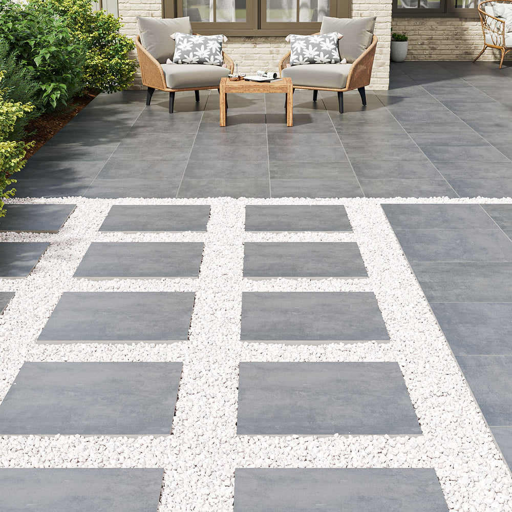 Displaying the refined texture of BETON ANTRACITE 24X24 PAVER PORCELAIN PAVER with a MATTE finish, blending effortlessly with the surrounding modern elements.