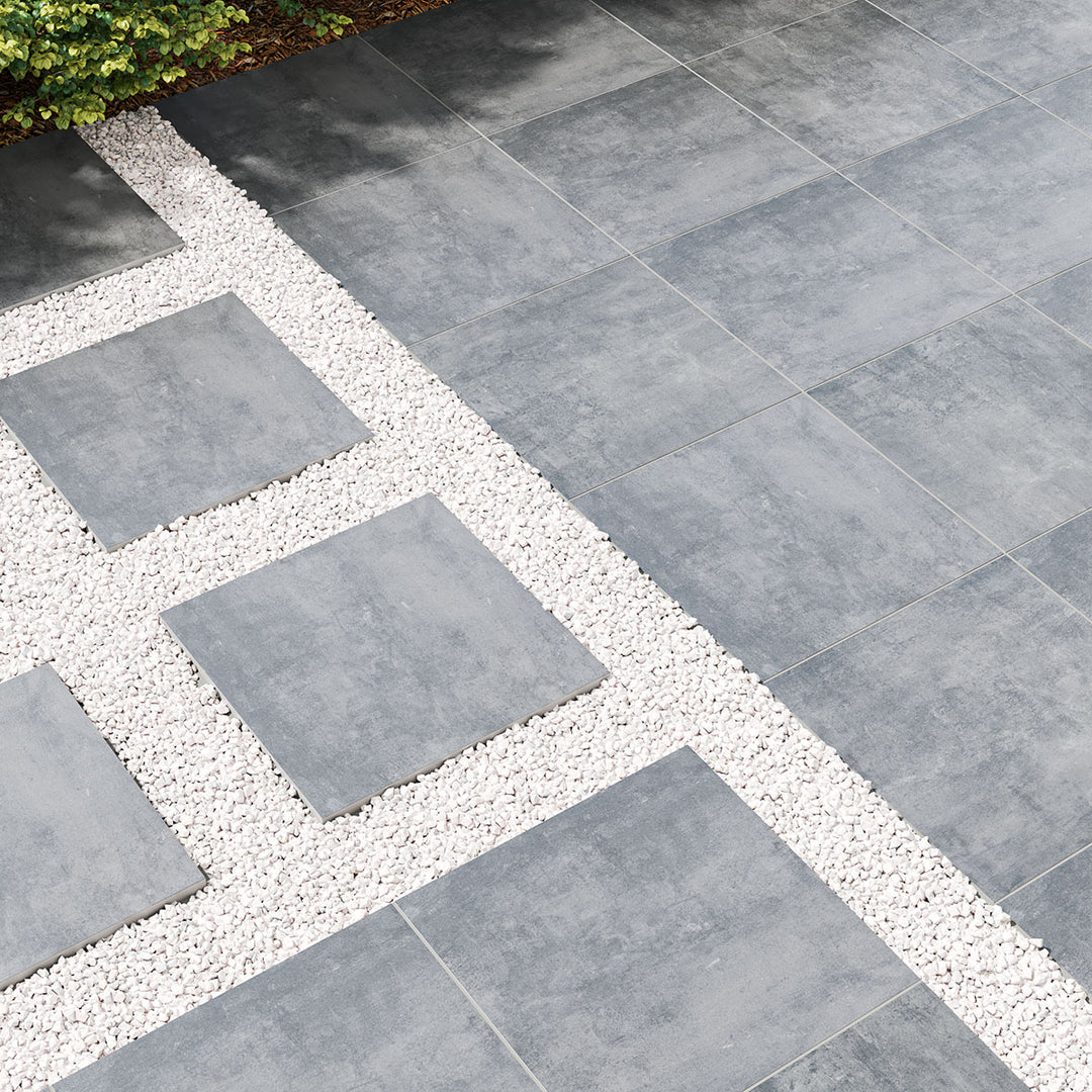 Benton Antracite 24x24 paver porcelain showcases a matte surface and rich dark hues, enhancing contemporary outdoor designs.