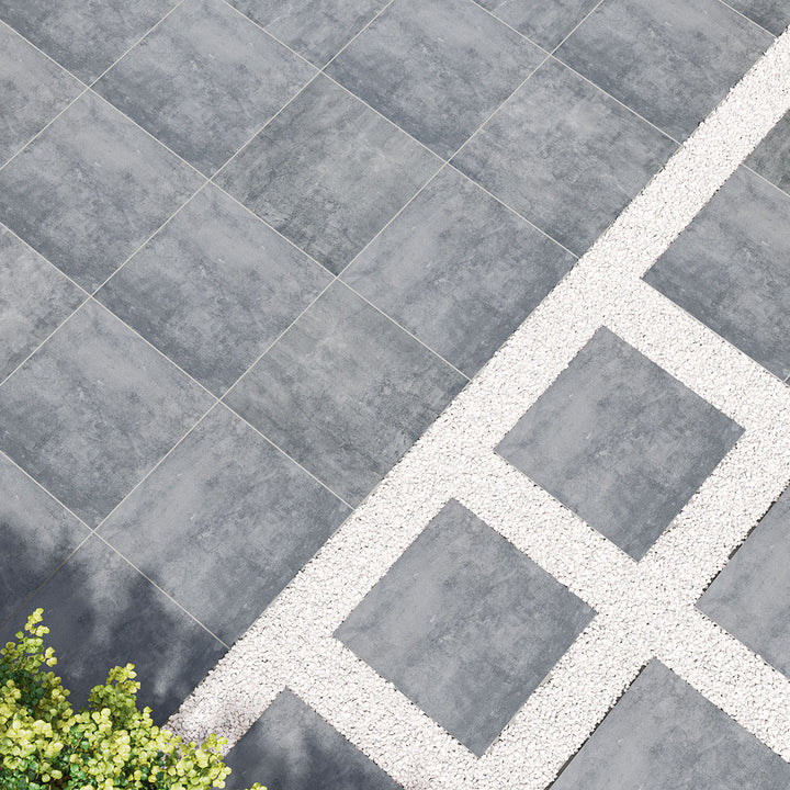 A deep, moody anthracite shade adds a modern industrial touch, pairing seamlessly with Benton Antracite 24X24 Paver Matte Porcelain.