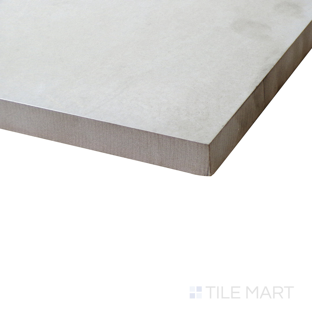 Corner shot of BETON BLANCO 24X24 PAVER PORCELAIN PAVER with a MATTE finish, offering a close-up look at the product's durability and material thickness at the corner.