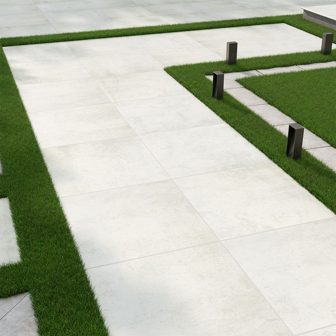 Bright and inviting patio featuring Benton Blanco 24x24 paver matte porcelain, perfect for a clean and airy look.