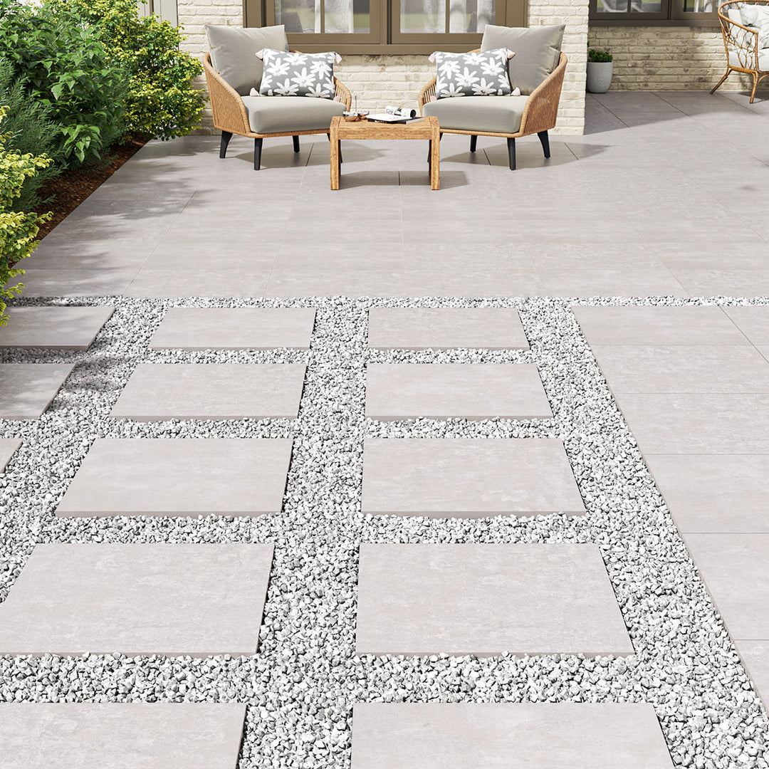 A large-format paver in soft gray tones enhances the outdoor aesthetic with durability and elegance using Benton Grey 24x24 paver matte porcelain.