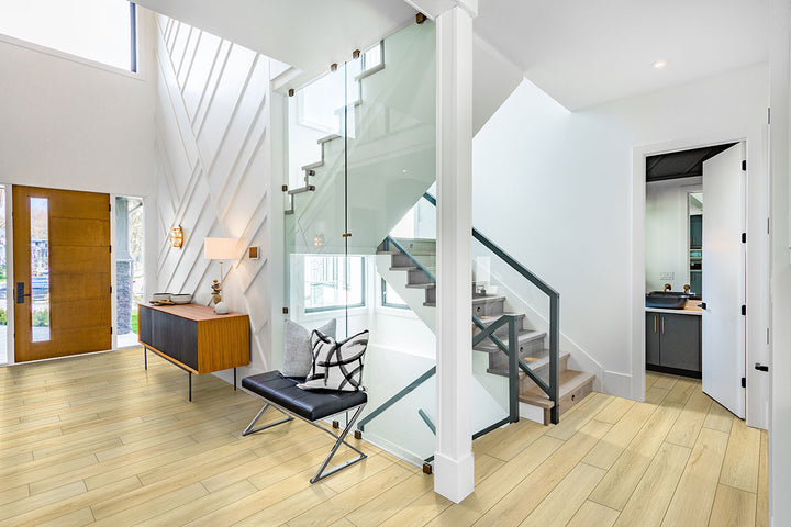 Charming living room grounded in Smithcliffs Glenbury Oak 7x48 vinyl flooring, where rich oak grain and neutral hues anchor classic and modern furnishings alike.