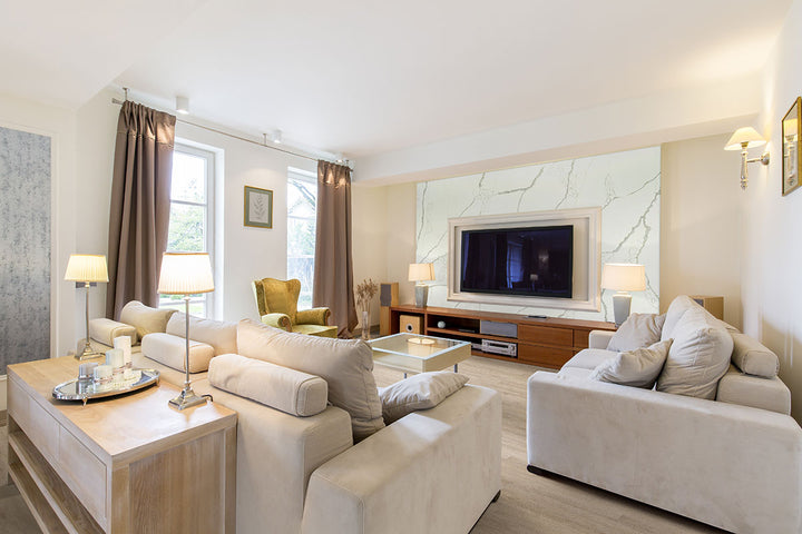 Modern living room with white furniture, TV, and décor fearturing Cyrus 2.0 Sandino 7X48 Low Gloss Luxury Vinyl Plank