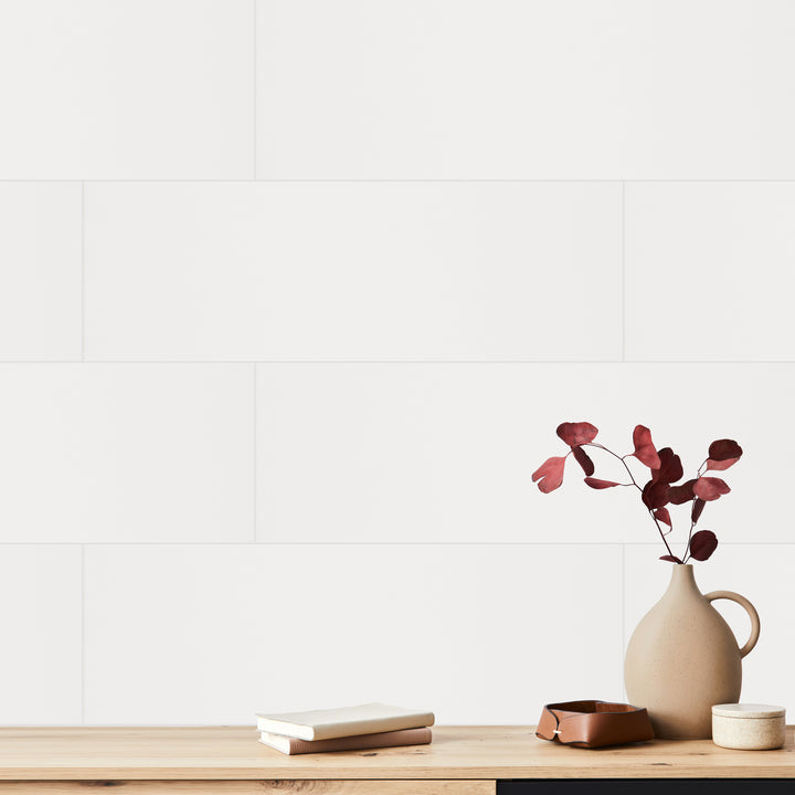 Realistic interior featuring Nuvo Calm 12x36 Satin Ceramic Tile, where its muted finish and elongated form create a soothing, balanced backdrop.