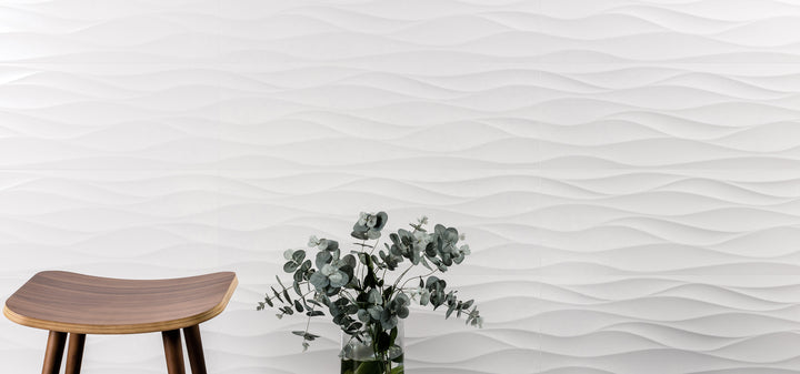 Designed with flowing texture, the Nuvo Wave 12x36 Satin Ceramic Tile adds visual rhythm and surface contrast to the room.