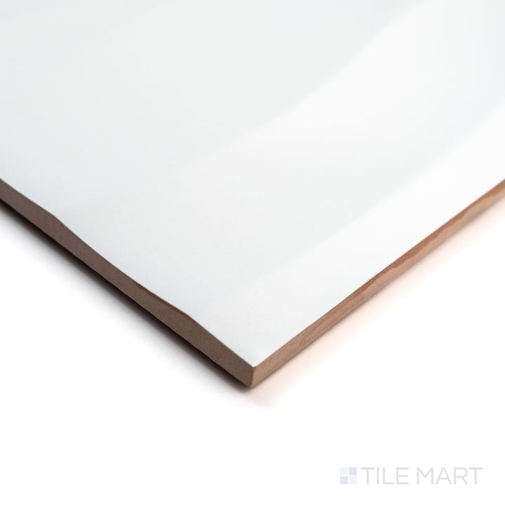 Angled image of Nuvo Wave 12x36 Satin Ceramic Tile showcasing its flowing wave pattern and satin finish viewed from a corner perspective.