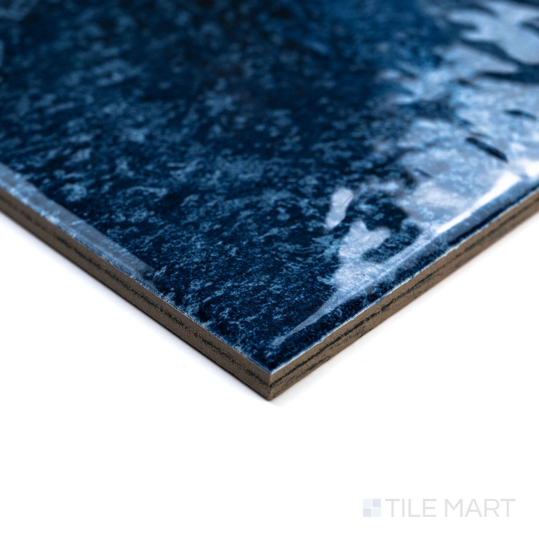 Rini Ocean 6x6 Glossy Glazed Porcelain Tile in a corner view, capturing the depth and richness of its ocean-inspired hue with a glossy finish.