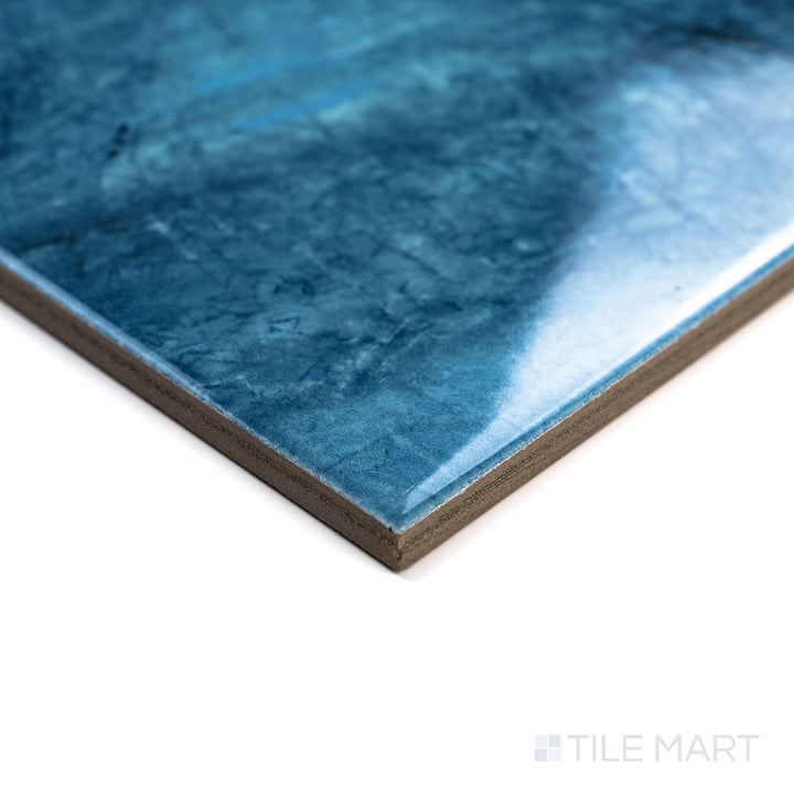 Corner angle image of Rini Bastile 6x6 Glossy Glazed Porcelain Tile highlighting its elegant color variation and reflective glazed surface.