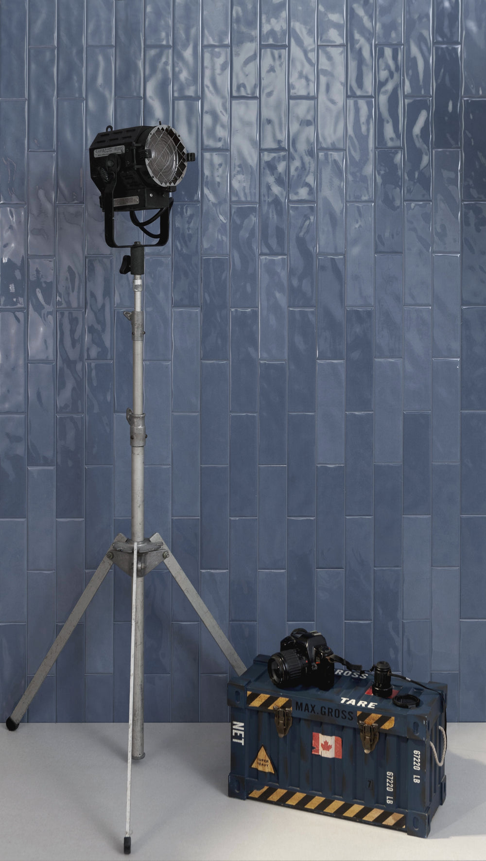 Canvas Konjo Blue 3x10 Glossy Ceramic Tile featured in a vibrant room, where its deep blue hue and glossy finish create a strong visual impact.