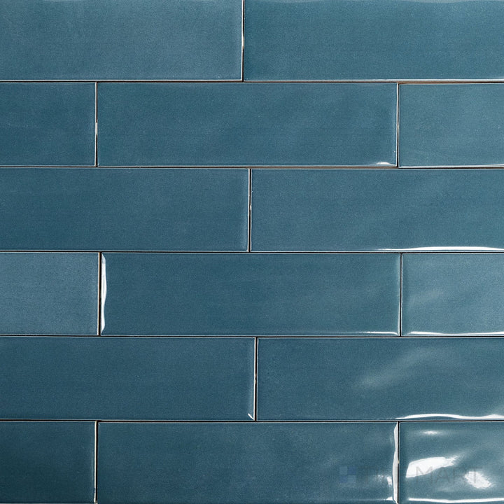 Overview image of Canvas Konjo Blue 3x10 Glossy Ceramic Tile with a vibrant blue glaze and sleek, elongated shape ideal for expressive wall layouts.