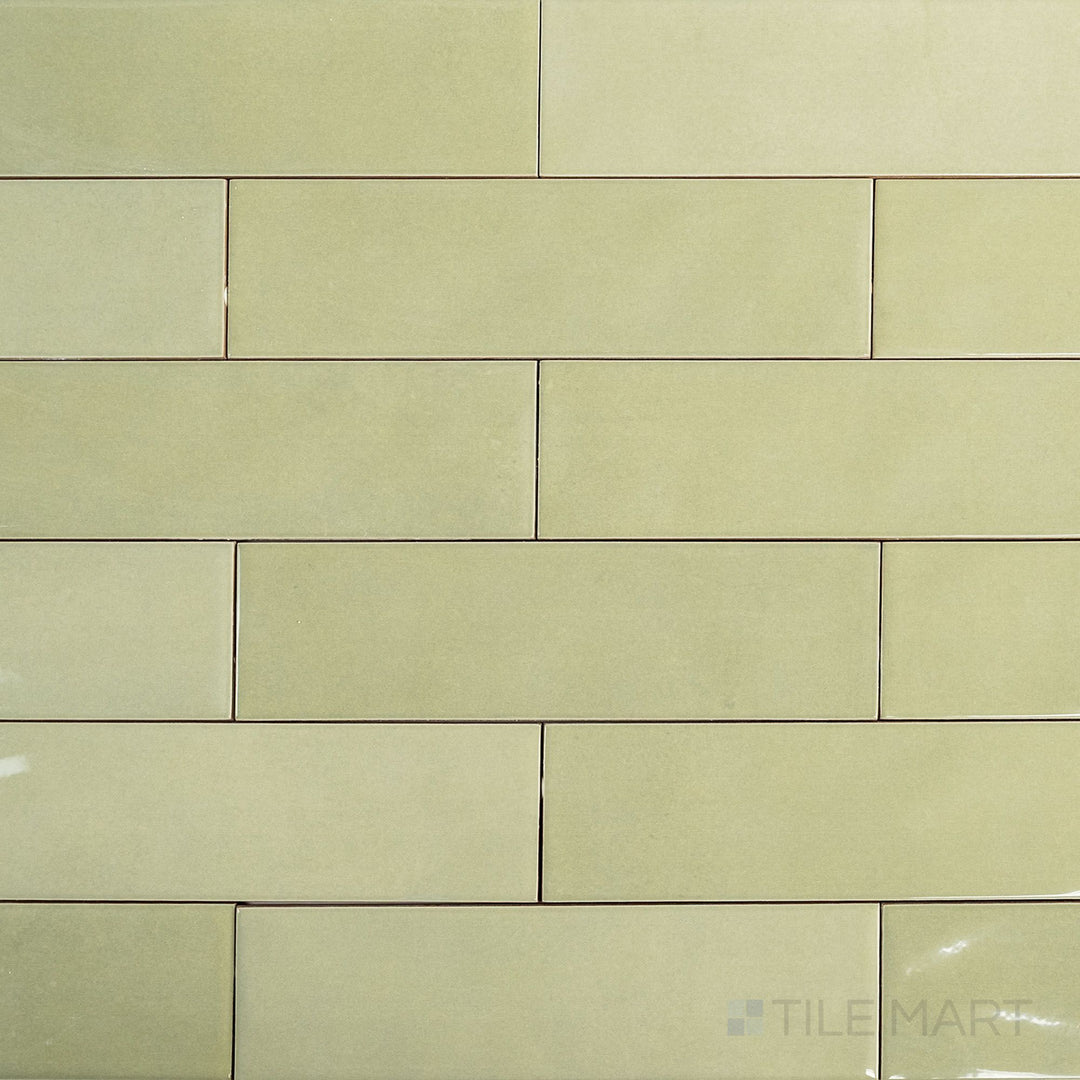 Full-tile overview of Canvas Green Tea 3x10 Glossy Ceramic Tile showcasing its earthy green glaze and smooth reflective finish.
