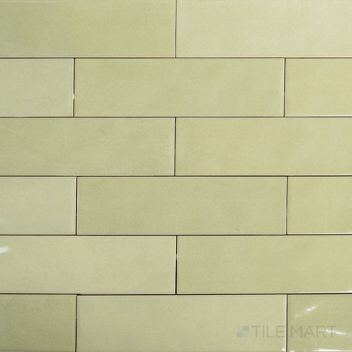 Full-tile overview of Canvas Green Tea 3x10 Glossy Ceramic Tile showcasing its earthy green glaze and smooth reflective finish.